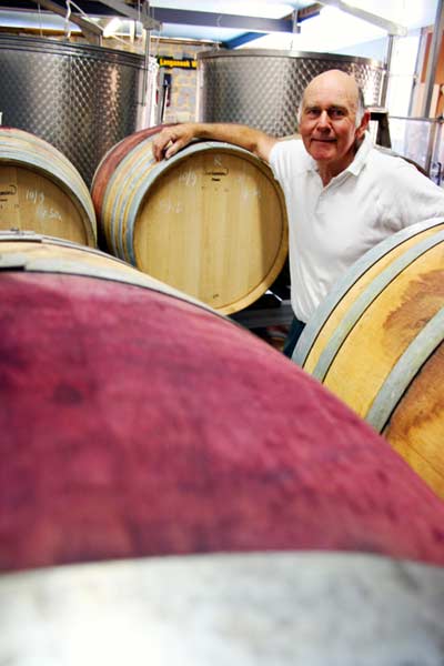 Matt Hunter with wine barrels